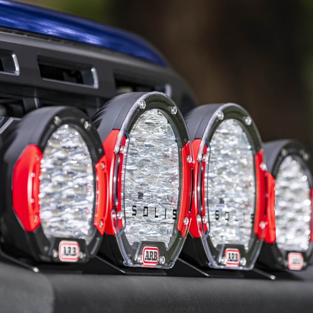 Intensity Solis Group Shot on side angle mounted on black bull bar with red bezels